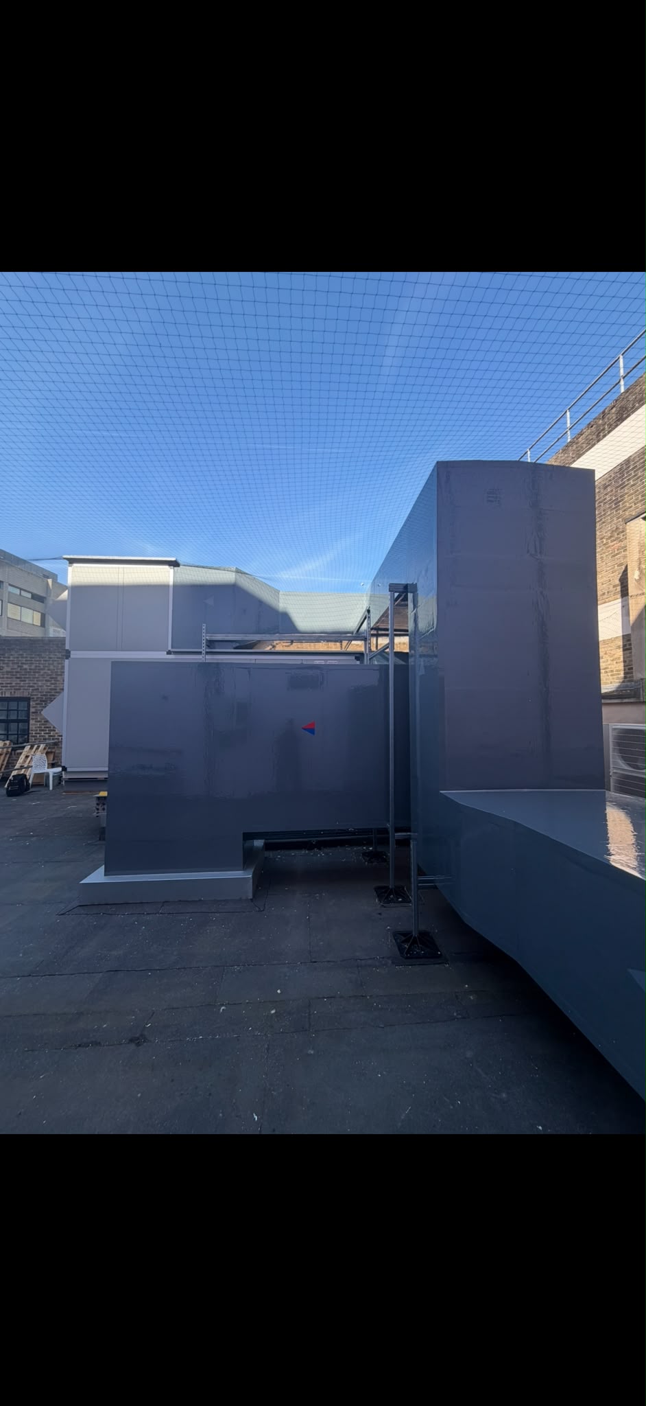 RAC project photograph of externally insulated rooftop ductwork with a grey protective finish